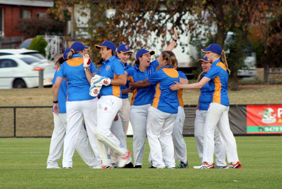 Team celebrates after caught ball